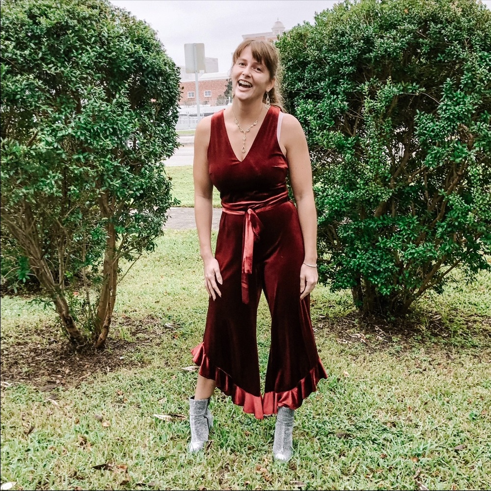 red velvet ruffled jump suit